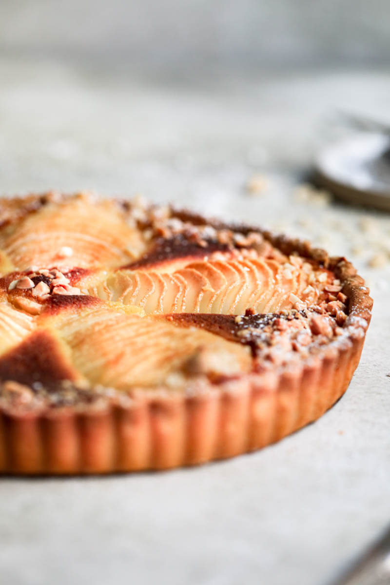 90° shot of half the baked pear frangipane tart