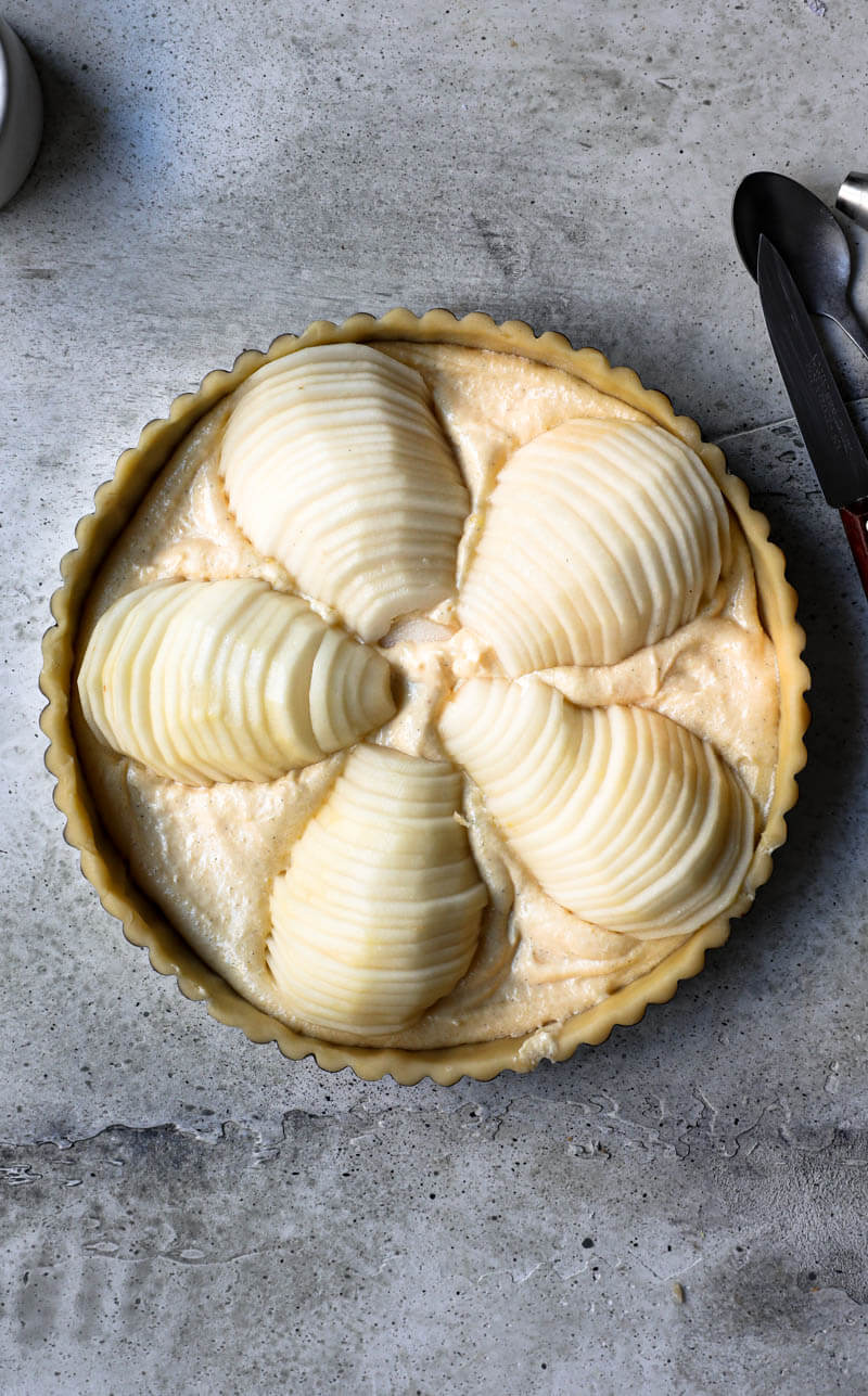 Overhead shot of the pear tart topped with the sliced pears