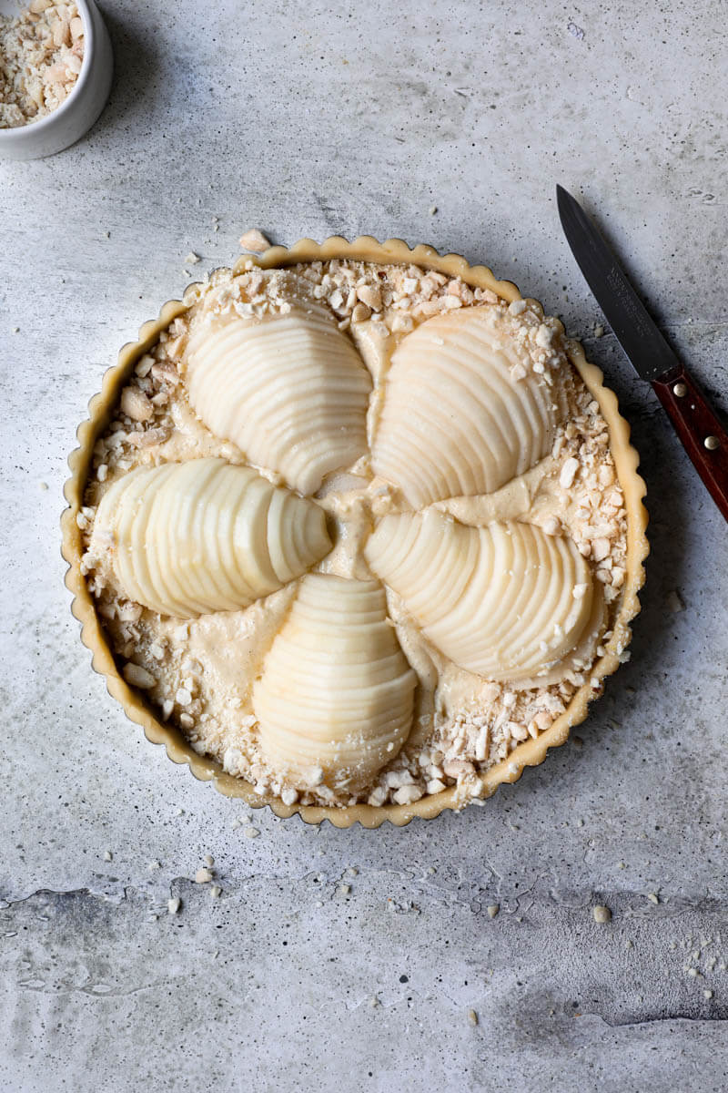 Overhead shot of the pear frangipane tart sprinkled with chopped almonds