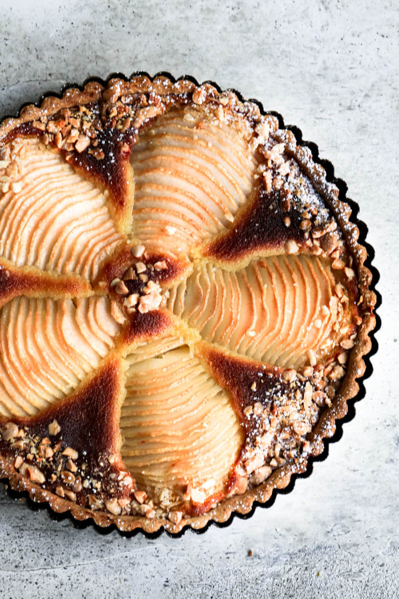 Overhead shot of the baked pear frangipane tart in the tart tin