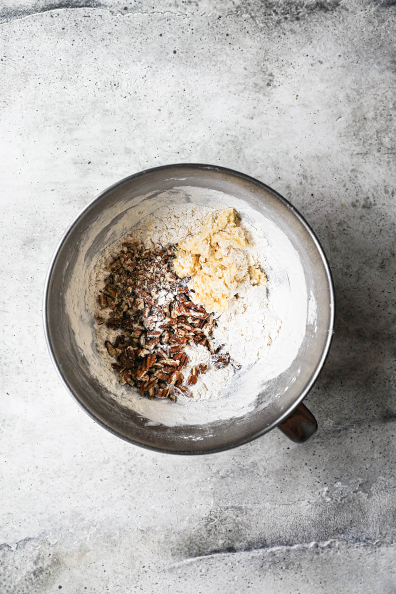 A bowl with the dough plus pecans plus the rest of the flour