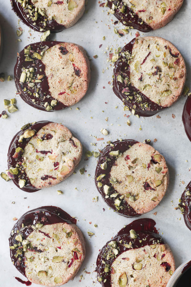 The shortbread cookies dipped in chocolate drizzled with crushed pistachios.