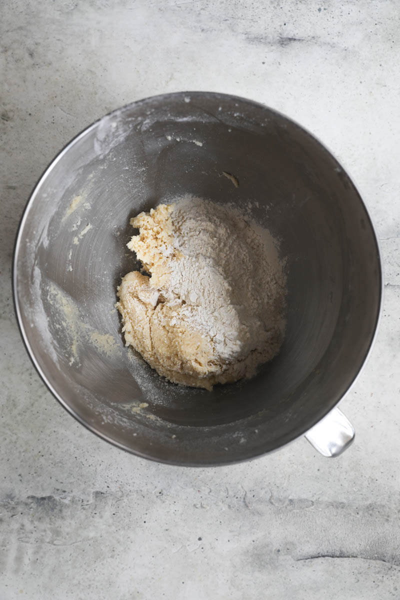 The cookie dough plus the remaining flour inside a bowl.