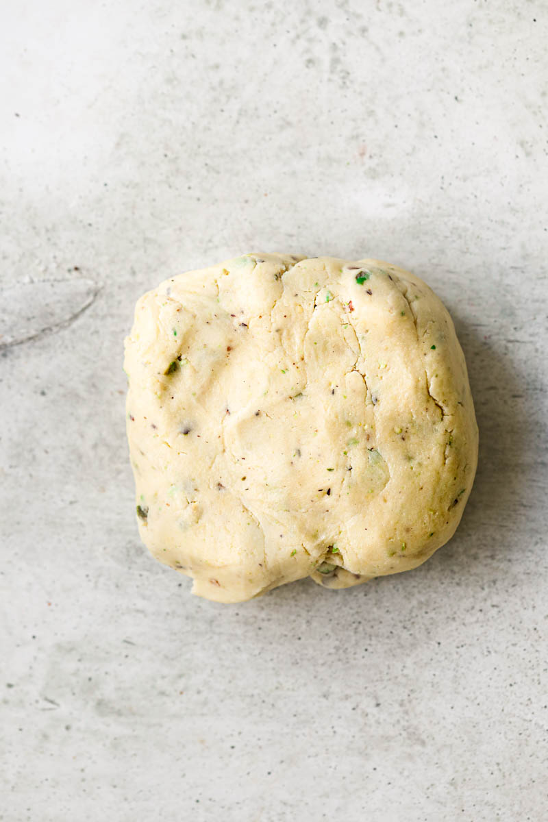 Making the pistachio shortbread for the tartlets: The shortbread crust shaped in a rectangular form.