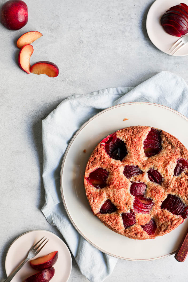 Overhead shot of the baked plum cake on a plate