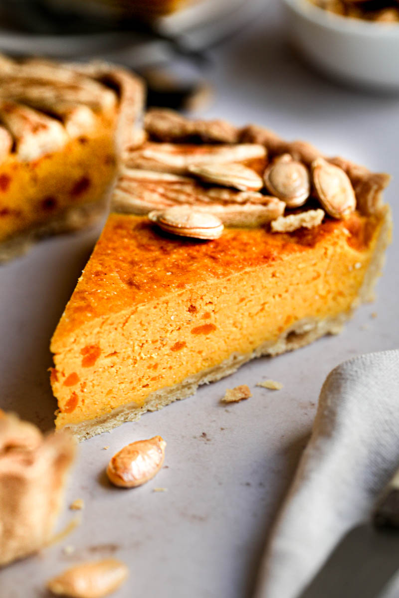 Closeup of one slice of pumpkin ricotta quiche.