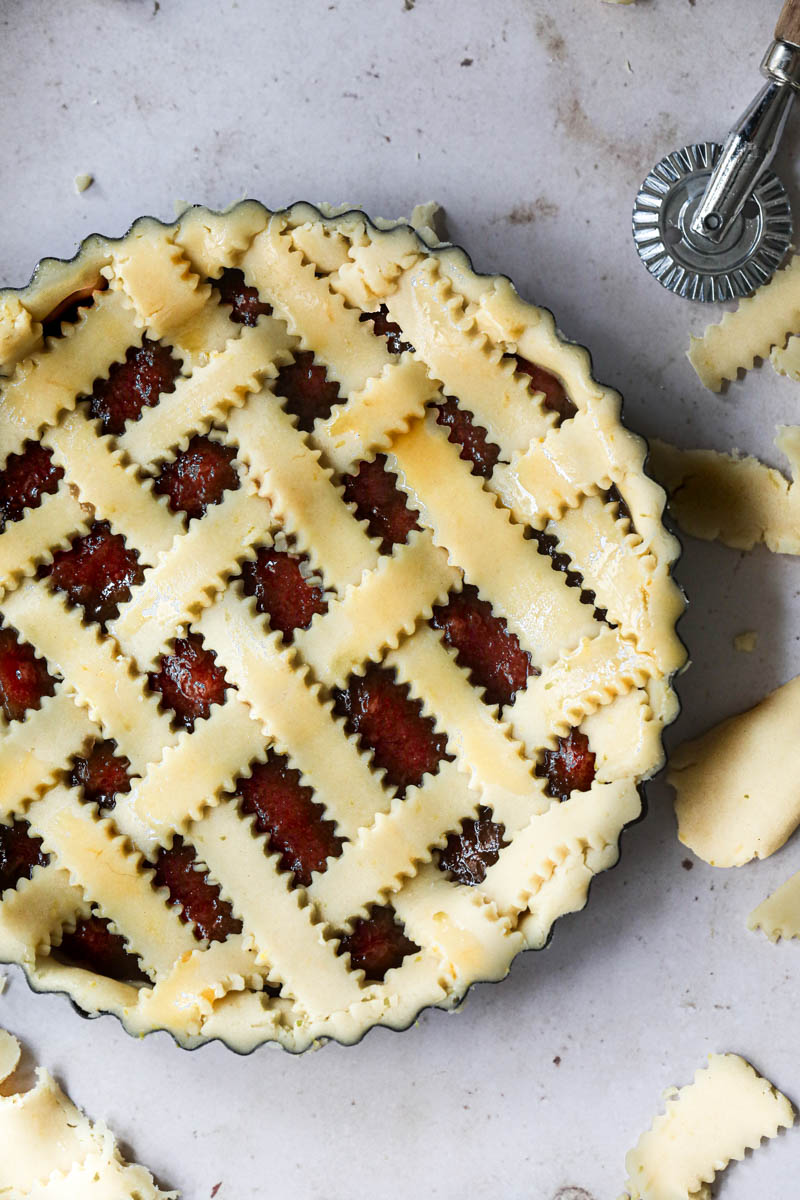 The lattice top quince pie brushed with egg wash.