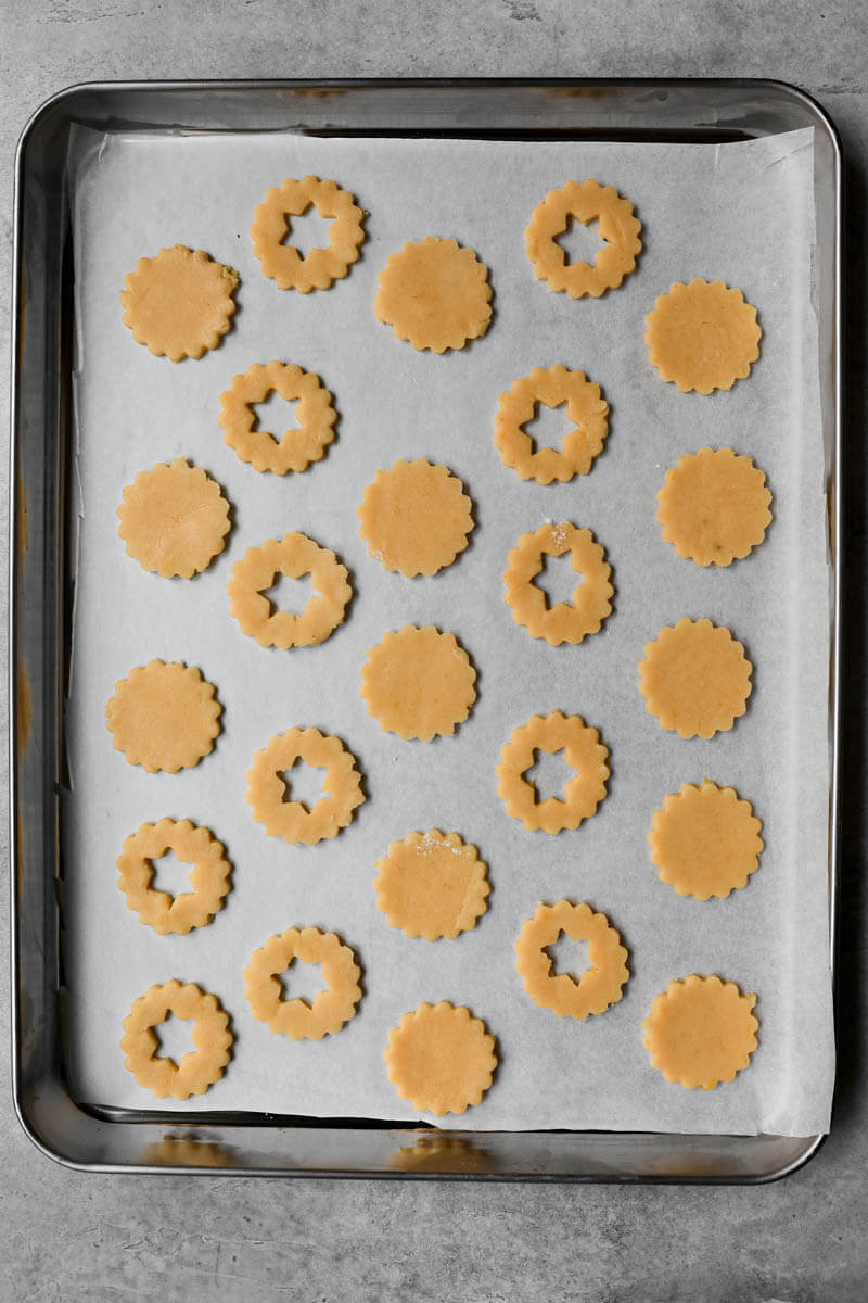 Linzer cookies on a lined baking tray ready to be baked