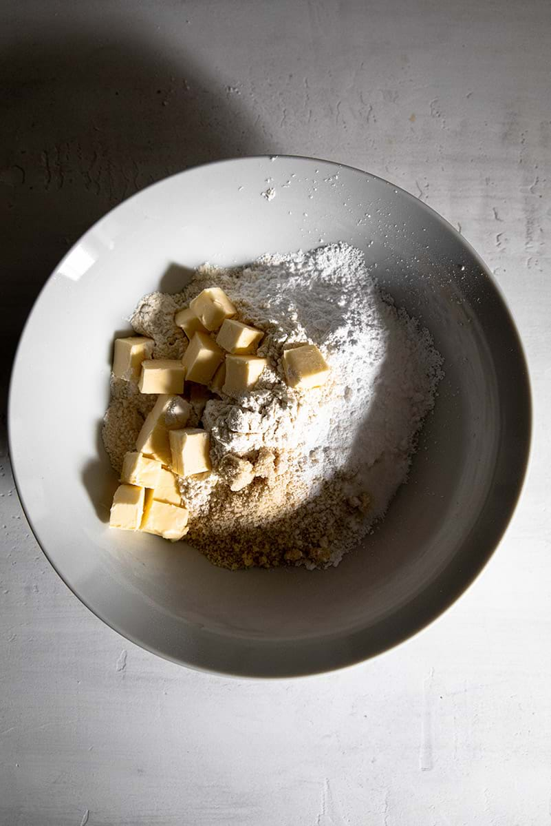 Dry ingredients for the shortbread crust with butter