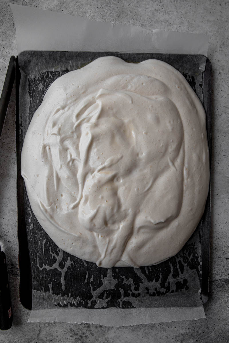 Roll cake batter on baking tray