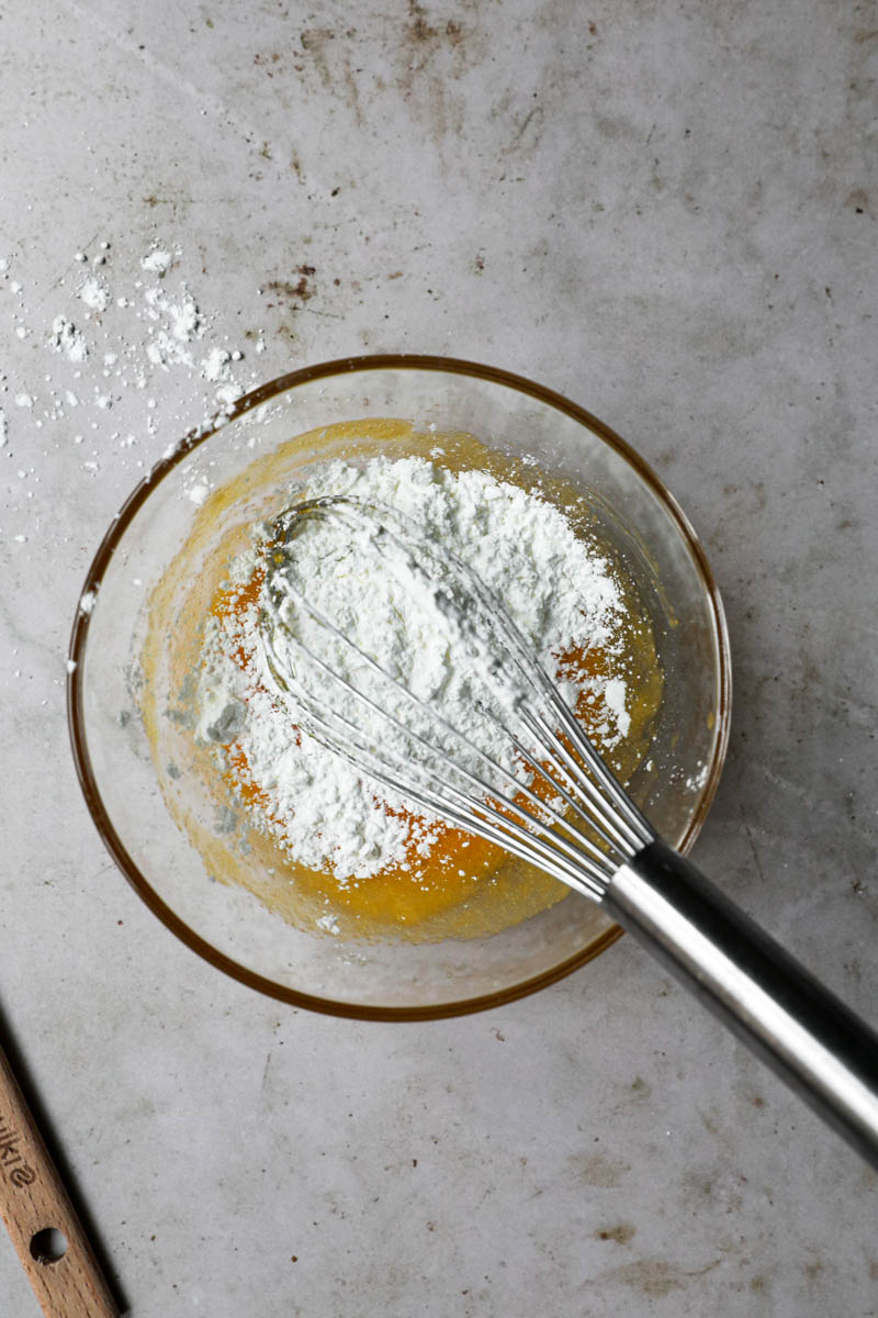 A bowl with egg yolk/sugar mixture plus the corn-starch.