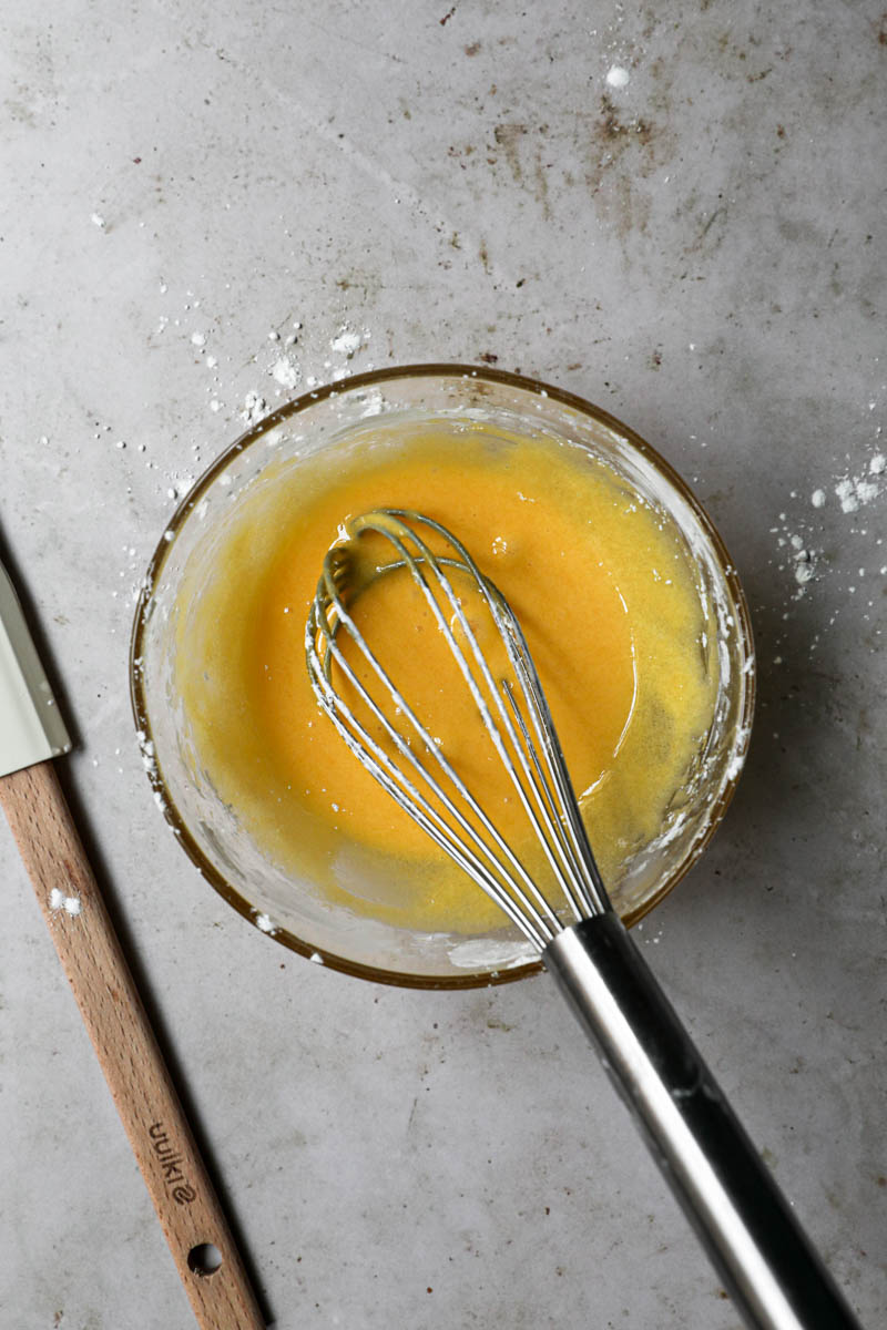 All three ingredients mixed to make the pastry cream: yolks, sugar, and corn-starch.