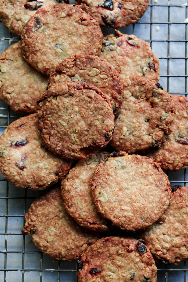 Baked oatmeal cookies cooling down on a wire rack