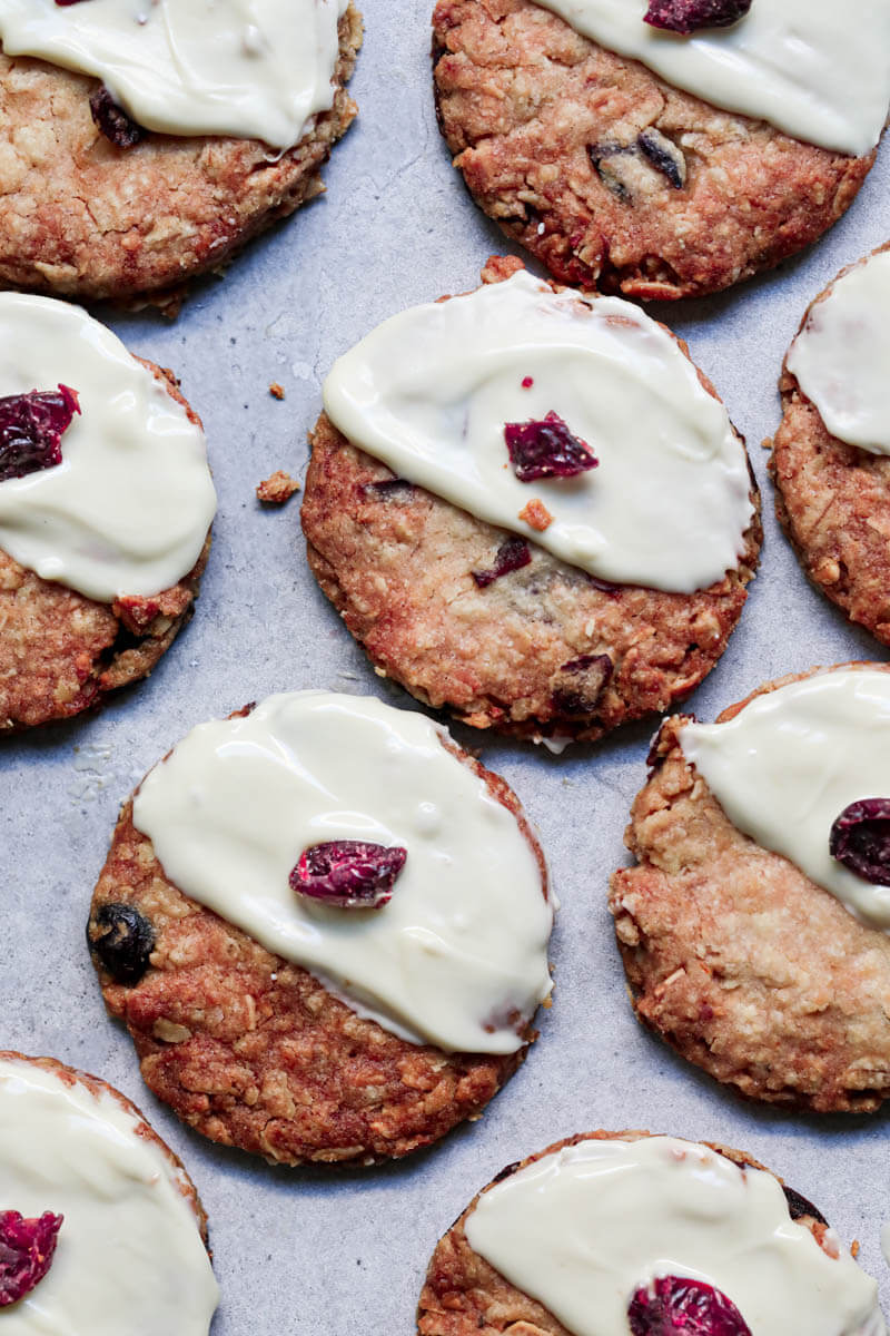 Baked cookies frosted with melted white chocolate