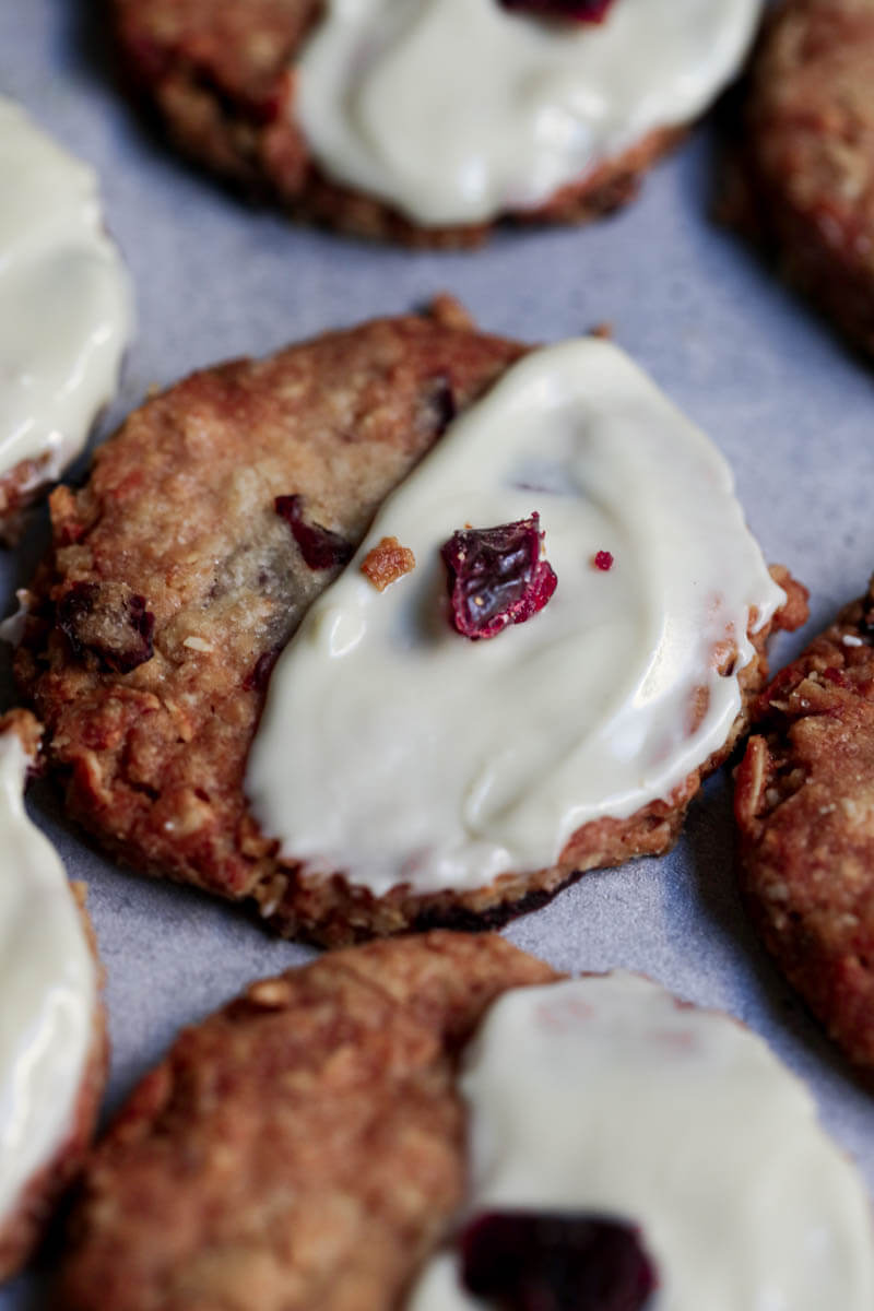 Baked cookies frosted with melted white chocolate