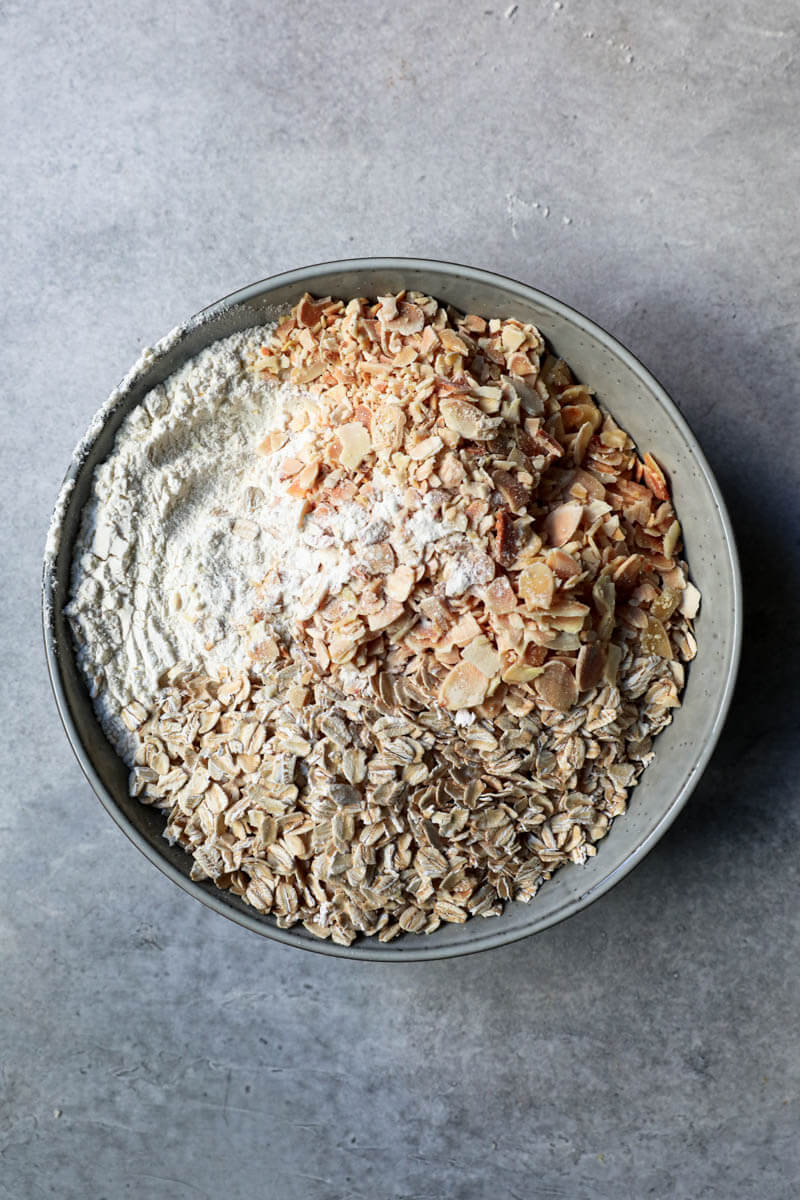 Dry ingredients in a bowl: almonds, oats, salt and flour