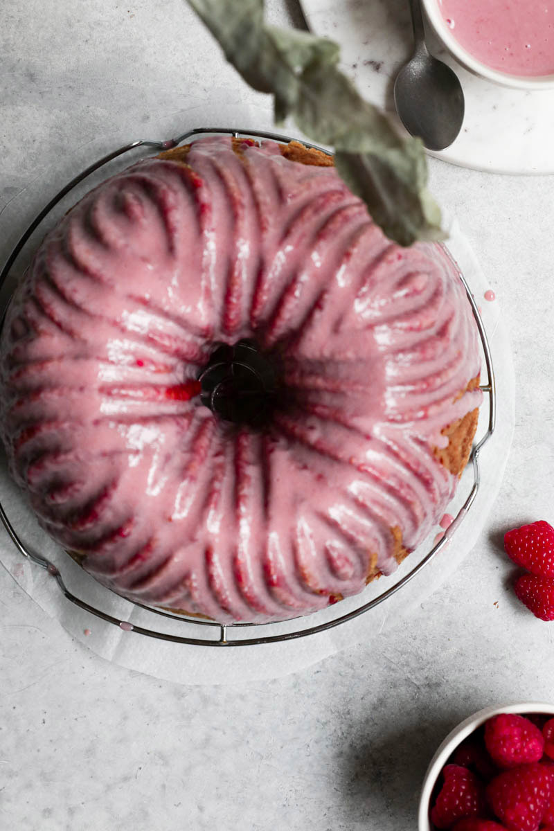 White chocolate raspberry cake with a pink glaze as seen from above.