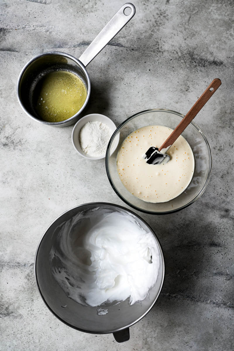 Components of the log cake: egg whites, melted butter, flour and egg/sugar mixture